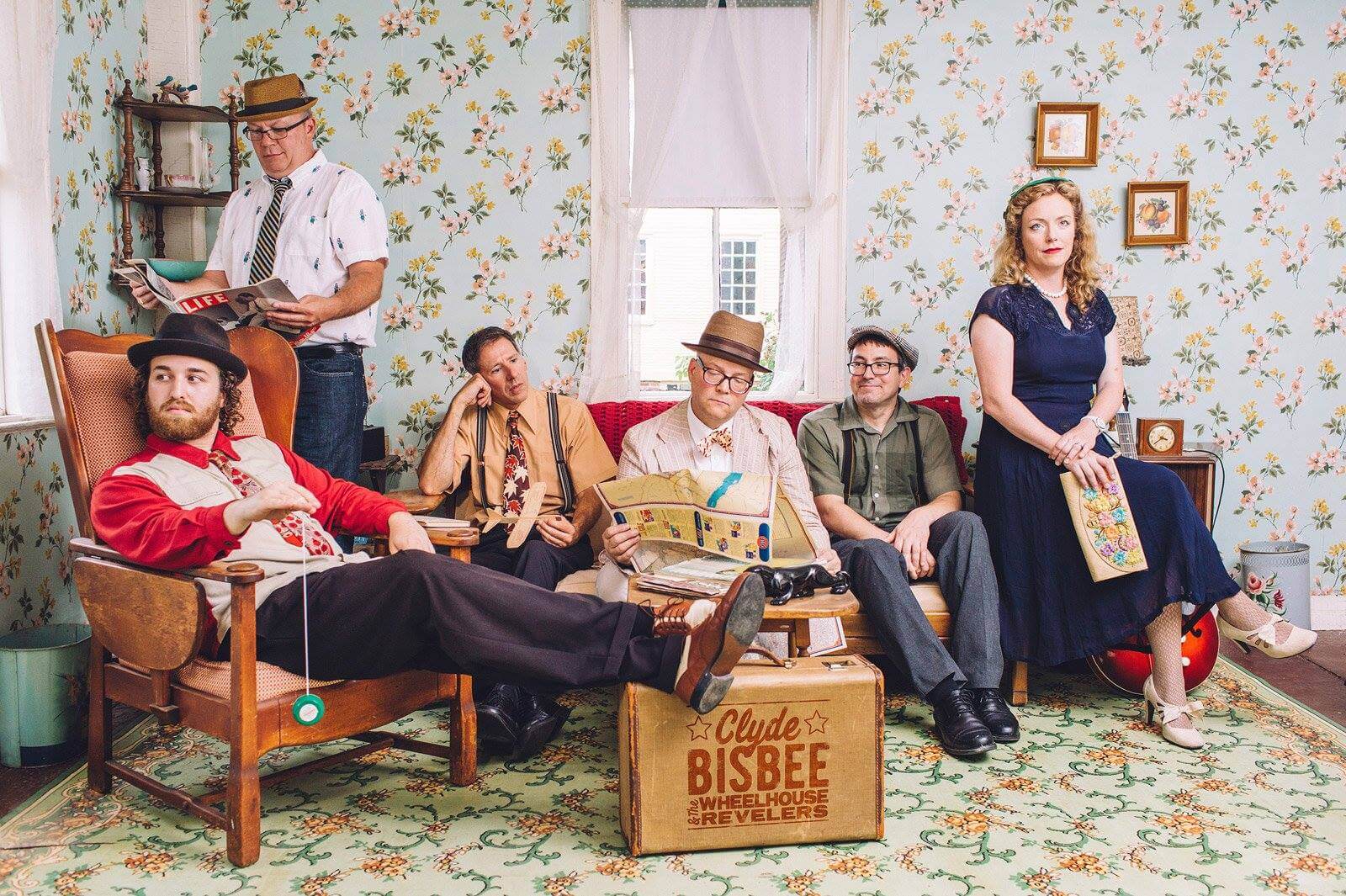 a six person band dressed in vintage attire